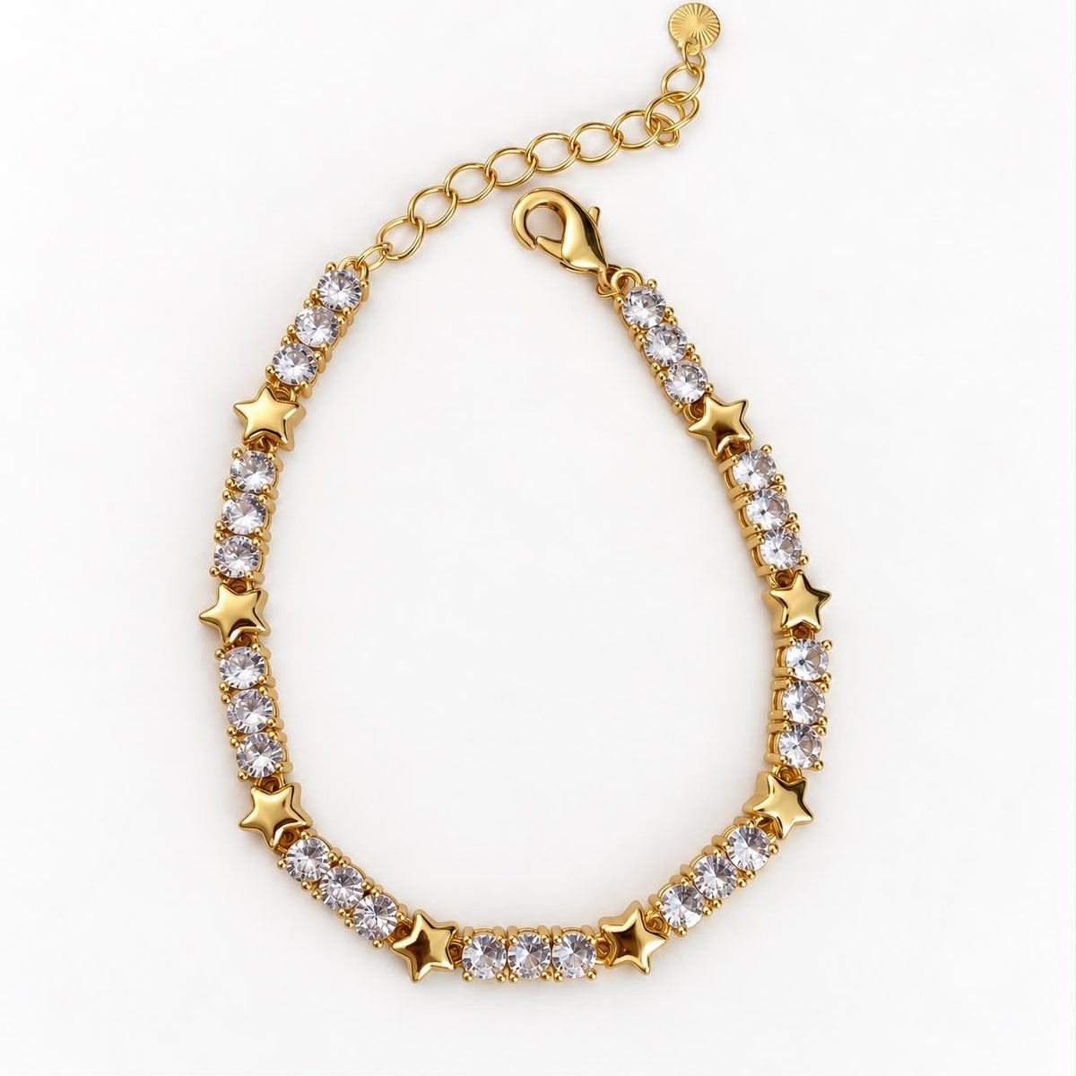 Pulsera dorada con estrellas y cristales transparentes