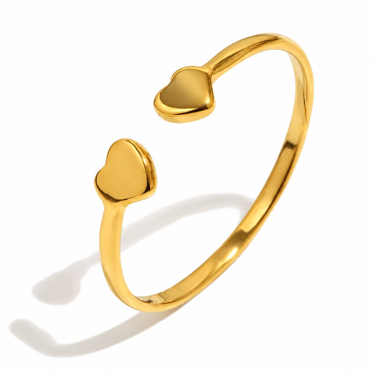 Anillo Dos Corazones dorado de acero inoxidable 316L, con aro abierto y un corazón en cada extremo.