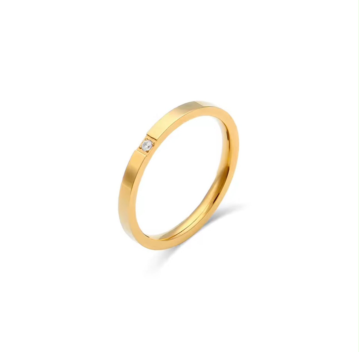 Anillo Punto de Luz dorado de acero inoxidable 316L, con aro delgado y una pequeña piedra, de talla fija.