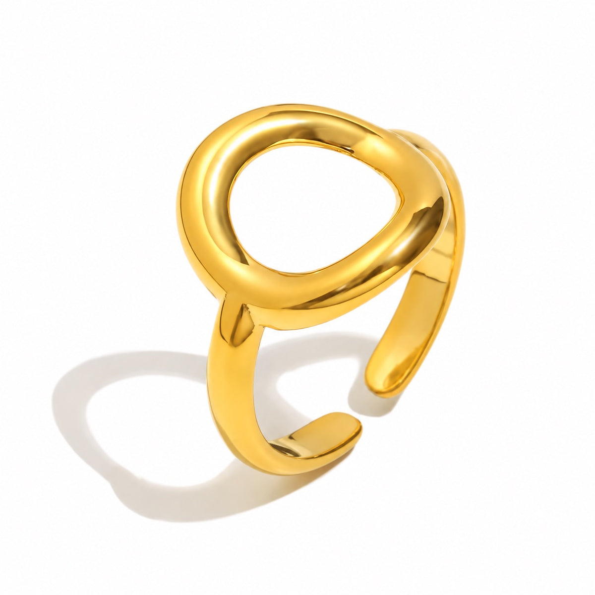 Anillo Órbita dorado ajustable de acero inoxidable 316L, con diseño de círculo y aro abierto.