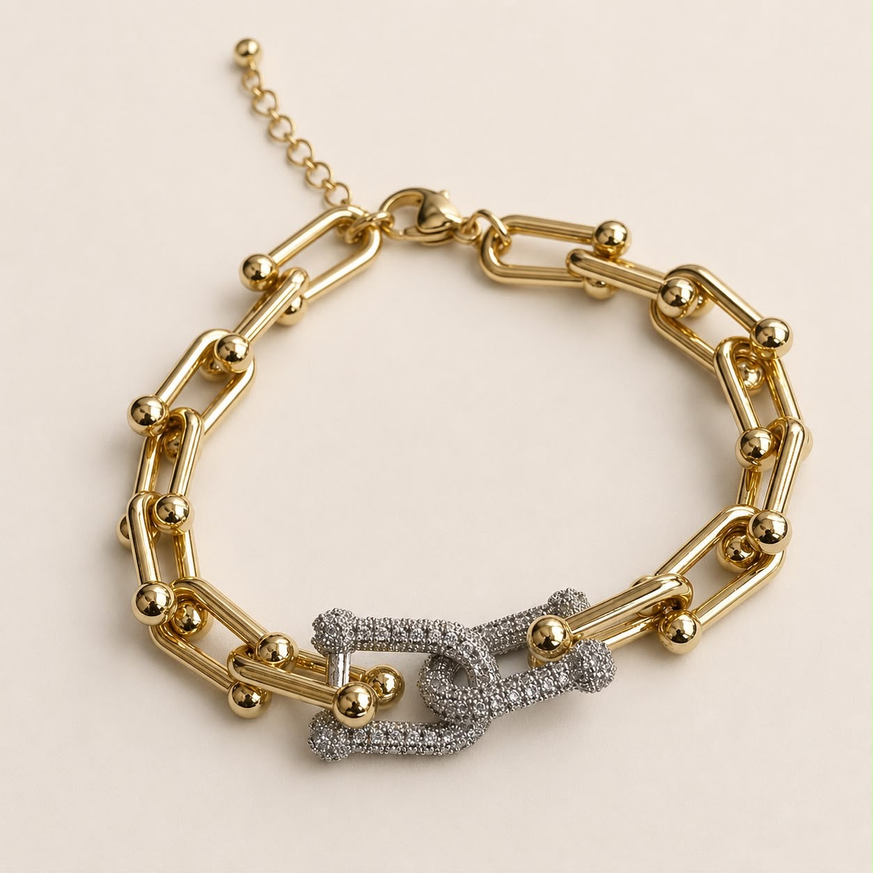 Pulsera Bicolor Tiffany de chapa de oro 18K con diseño femenino en tonos dorado y plateado.