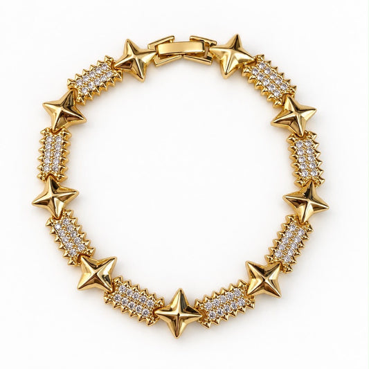 Pulsera dorada con estrellas y eslabones cubiertos de cristales