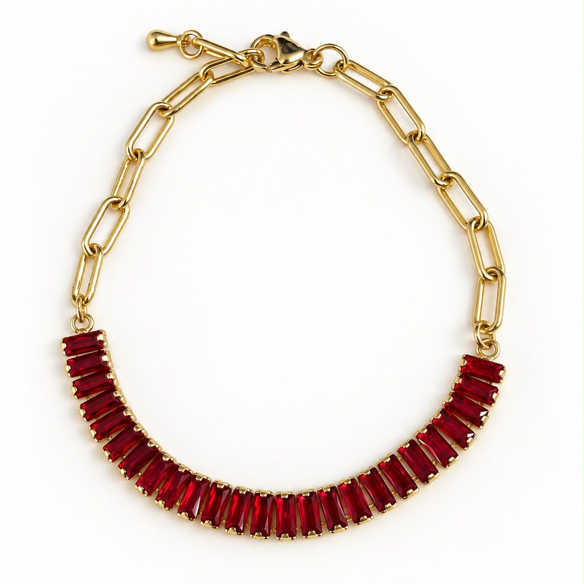 Pulsera dorada de eslabones con línea de cristales rojos
