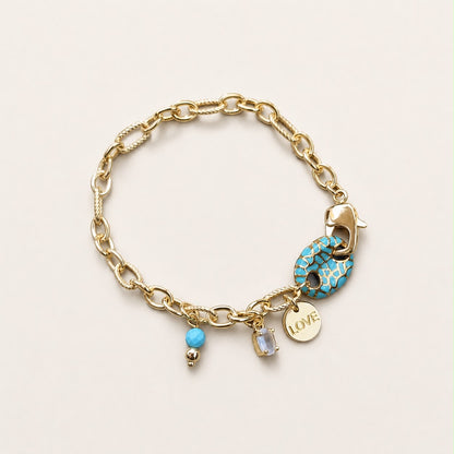 Pulsera dorada de chapa de oro, diseño femenino y versátil para joyería de mayoreo.
